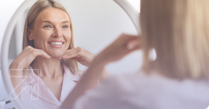 Woman smiling in the mirror